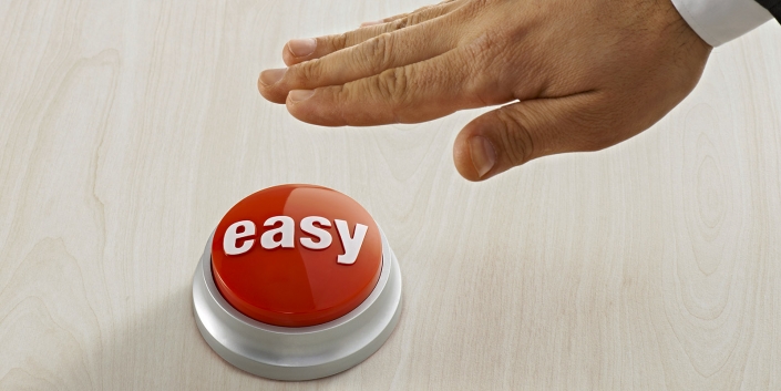 Businessman Reaching Easy Button