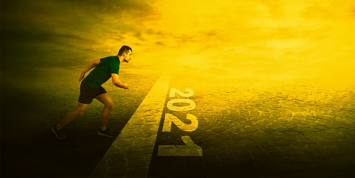 Determined man stands in running position, at the start line, looking ahead confident. Guy sprinter ready for starting 2021 new year challenges. Competitive winner behaviour and motivation concept.